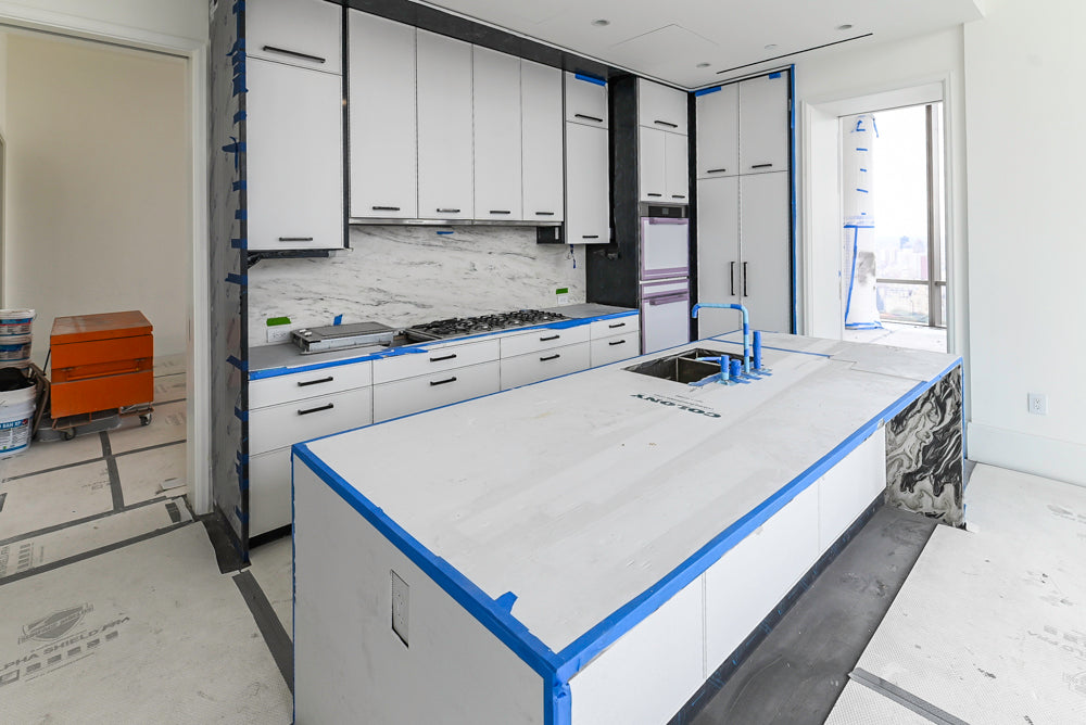 Custom Transitional White Kitchen with Island and Quartzite Countertops 