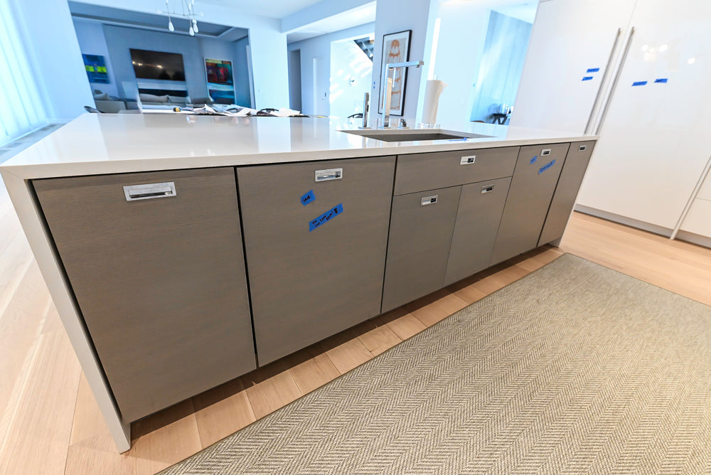 Brubaker Modern White Lacquered Kitchen with Waterfall Island and Stone Countertops