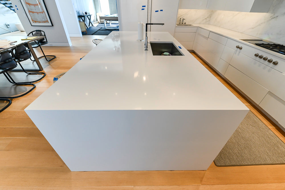 Brubaker Modern White Lacquered Kitchen with Waterfall Island and Stone Countertops
