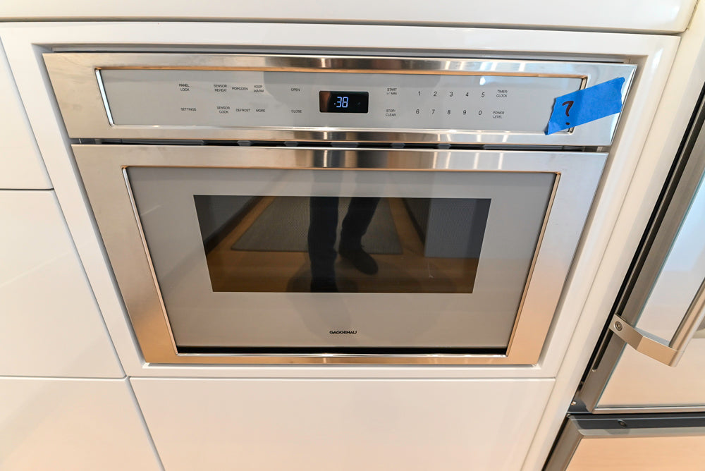 Brubaker Modern White Lacquered Kitchen with Waterfall Island and Stone Countertops