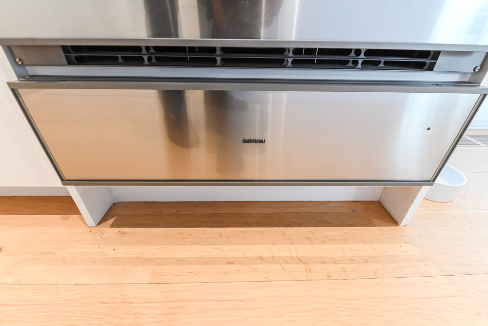 Brubaker Modern White Lacquered Kitchen with Waterfall Island and Stone Countertops