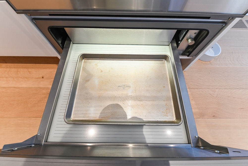 Brubaker Modern White Lacquered Kitchen with Waterfall Island and Stone Countertops