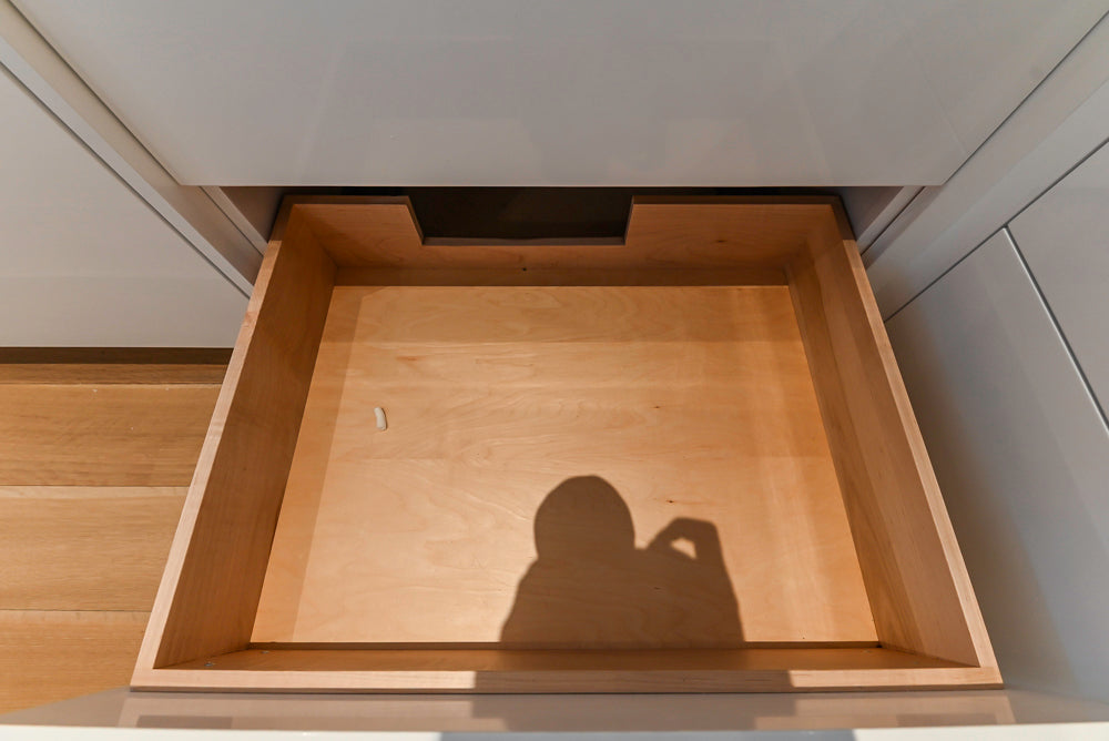 Brubaker Modern White Lacquered Kitchen with Waterfall Island and Stone Countertops