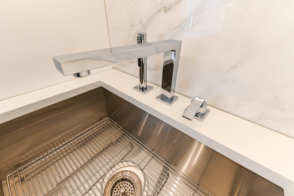 Brubaker Modern White Lacquered Kitchen with Waterfall Island and Stone Countertops