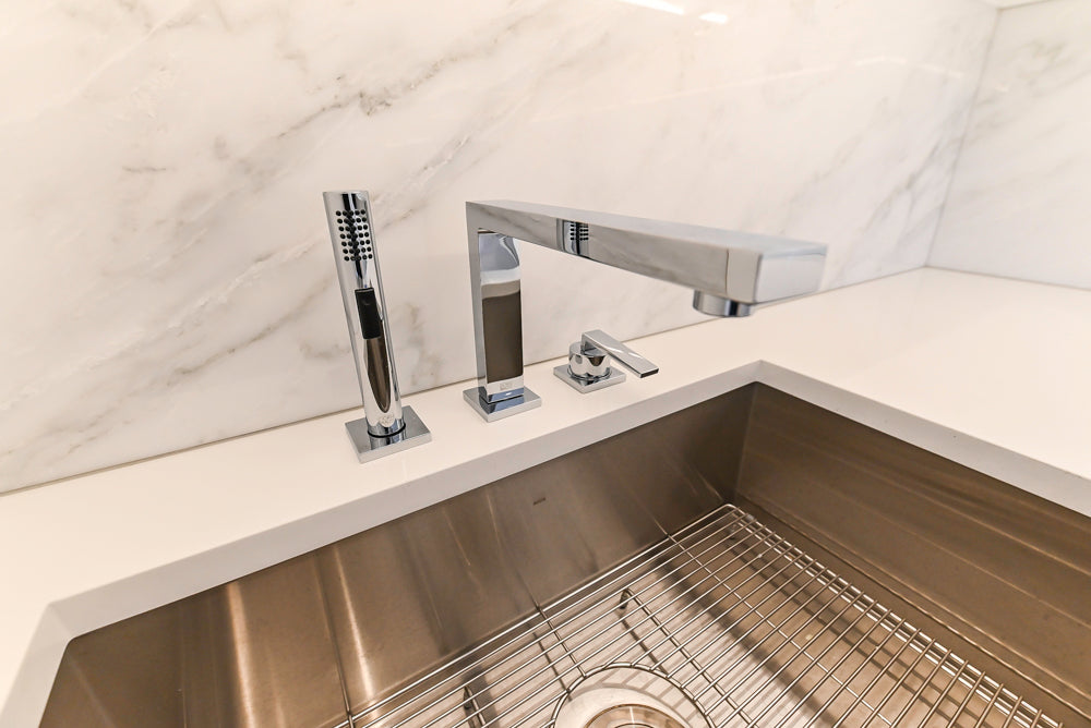 Brubaker Modern White Lacquered Kitchen with Waterfall Island and Stone Countertops