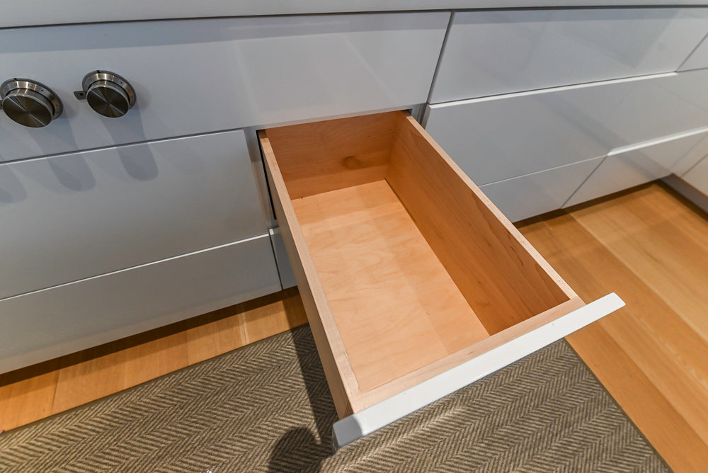 Brubaker Modern White Lacquered Kitchen with Waterfall Island and Stone Countertops