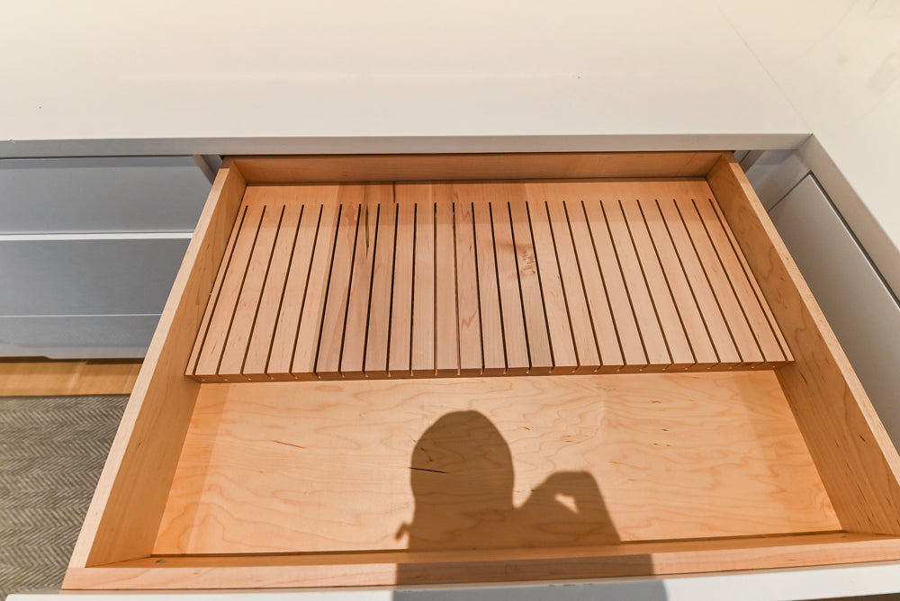 Brubaker Modern White Lacquered Kitchen with Waterfall Island and Stone Countertops