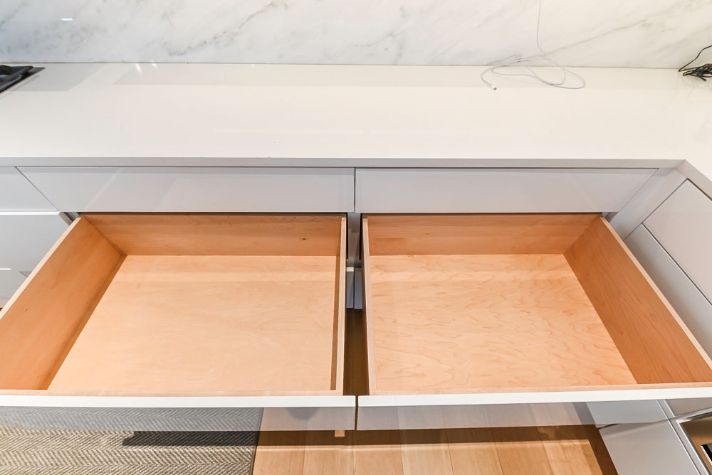 Brubaker Modern White Lacquered Kitchen with Waterfall Island and Stone Countertops