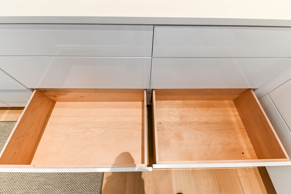 Brubaker Modern White Lacquered Kitchen with Waterfall Island and Stone Countertops