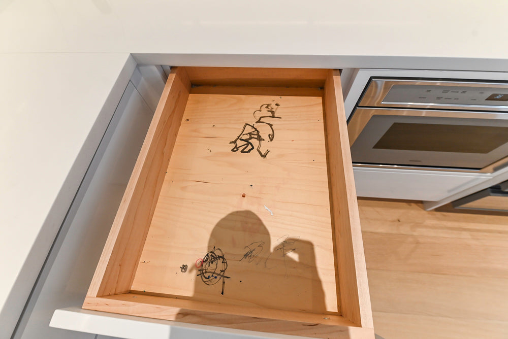 Brubaker Modern White Lacquered Kitchen with Waterfall Island and Stone Countertops