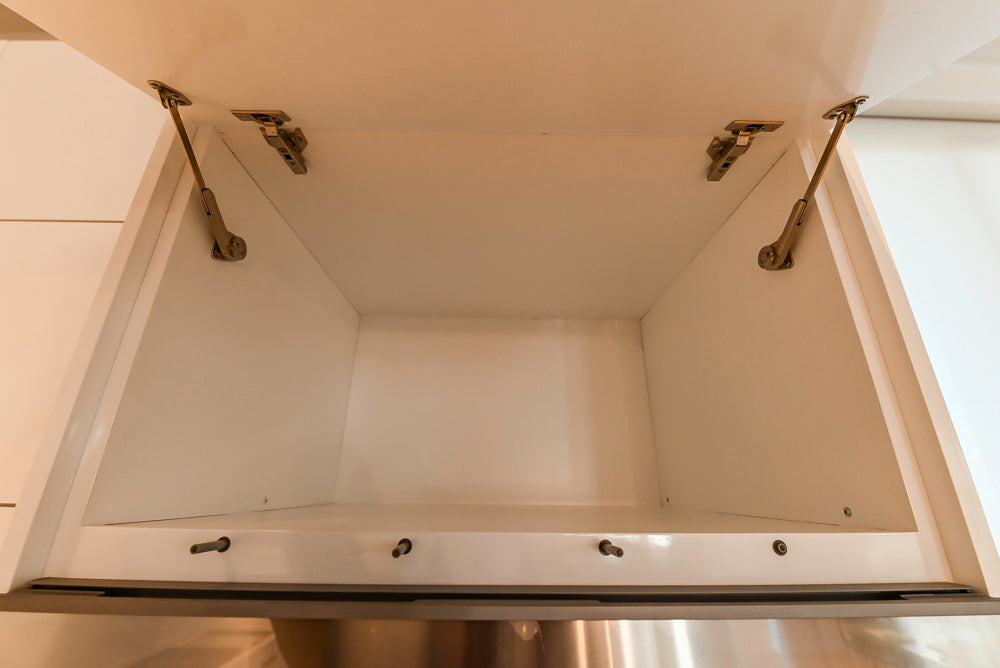 Brubaker Modern White Lacquered Kitchen with Waterfall Island and Stone Countertops