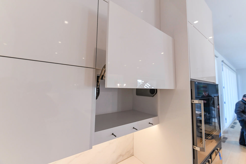 Brubaker Modern White Lacquered Kitchen with Waterfall Island and Stone Countertops