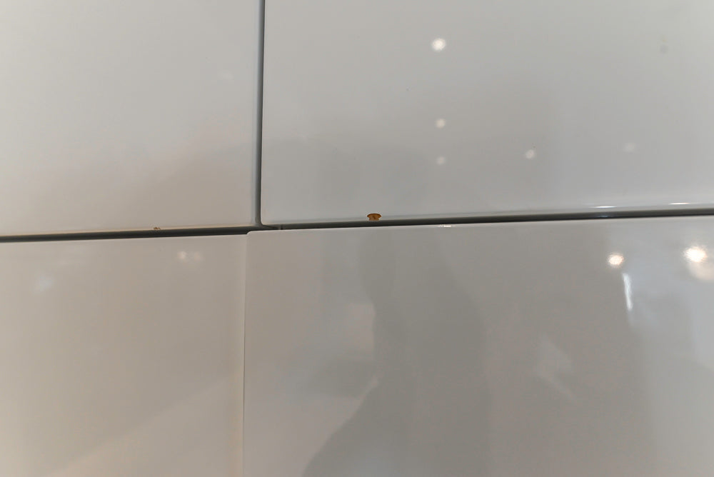 Brubaker Modern White Lacquered Kitchen with Waterfall Island and Stone Countertops