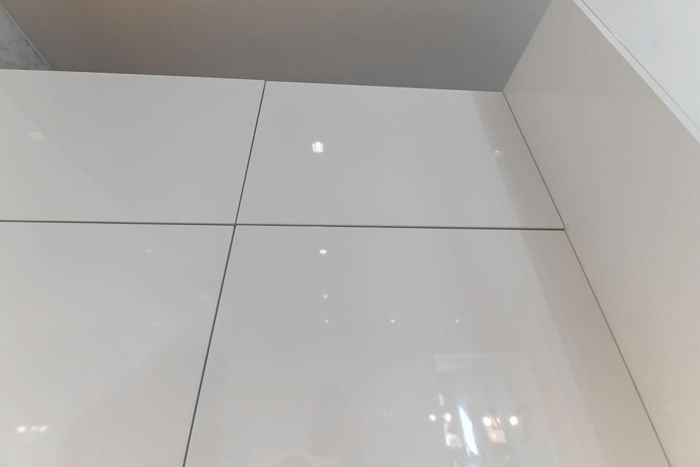 Brubaker Modern White Lacquered Kitchen with Waterfall Island and Stone Countertops