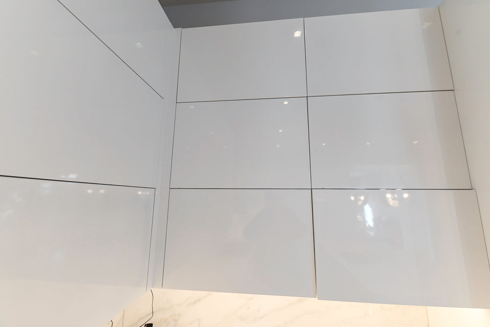 Brubaker Modern White Lacquered Kitchen with Waterfall Island and Stone Countertops