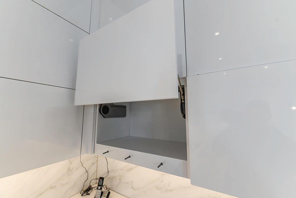 Brubaker Modern White Lacquered Kitchen with Waterfall Island and Stone Countertops