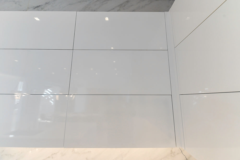 Brubaker Modern White Lacquered Kitchen with Waterfall Island and Stone Countertops