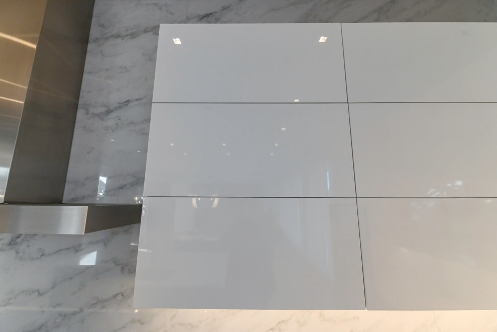 Brubaker Modern White Lacquered Kitchen with Waterfall Island and Stone Countertops