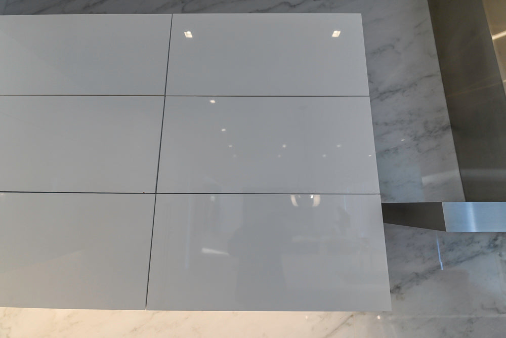 Brubaker Modern White Lacquered Kitchen with Waterfall Island and Stone Countertops