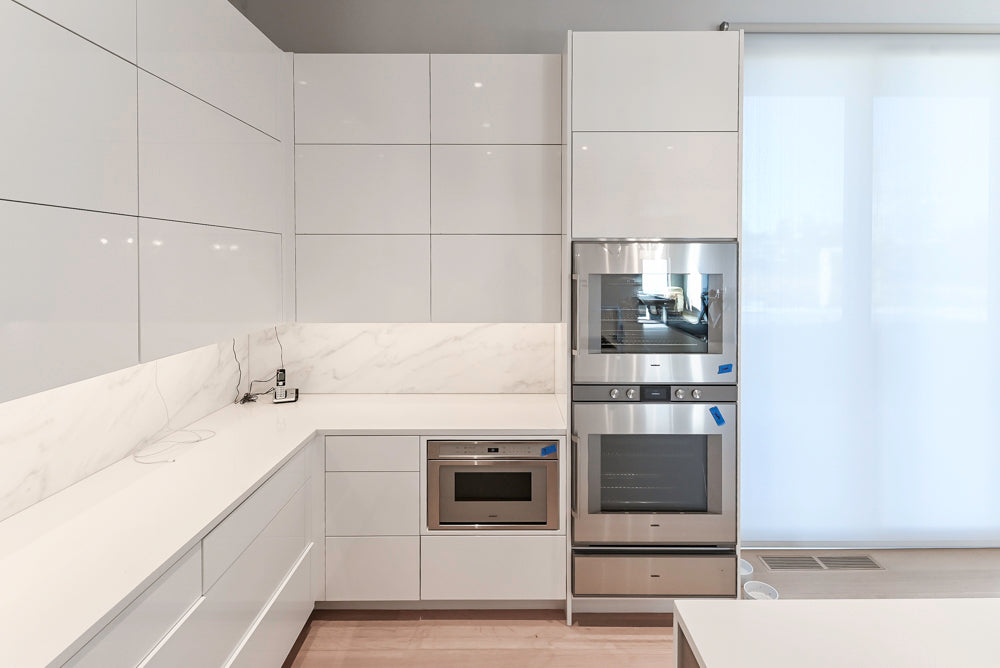 Brubaker Modern White Lacquered Kitchen with Waterfall Island and Stone Countertops