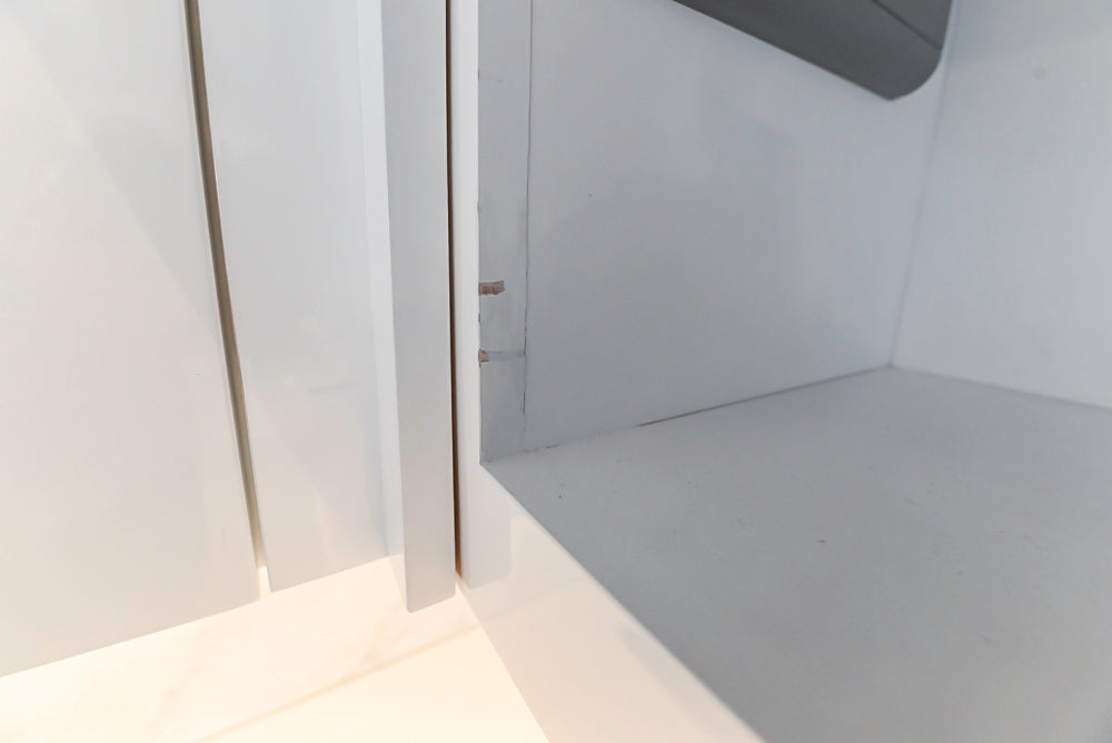 Brubaker Modern White Lacquered Kitchen with Waterfall Island and Stone Countertops