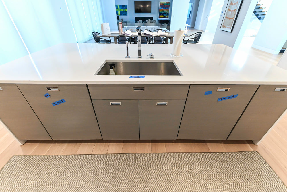 Brubaker Modern White Lacquered Kitchen with Waterfall Island and Stone Countertops