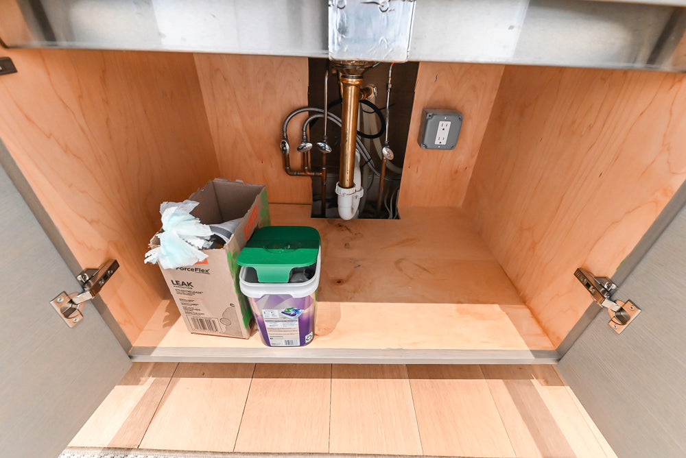 Brubaker Modern White Lacquered Kitchen with Waterfall Island and Stone Countertops