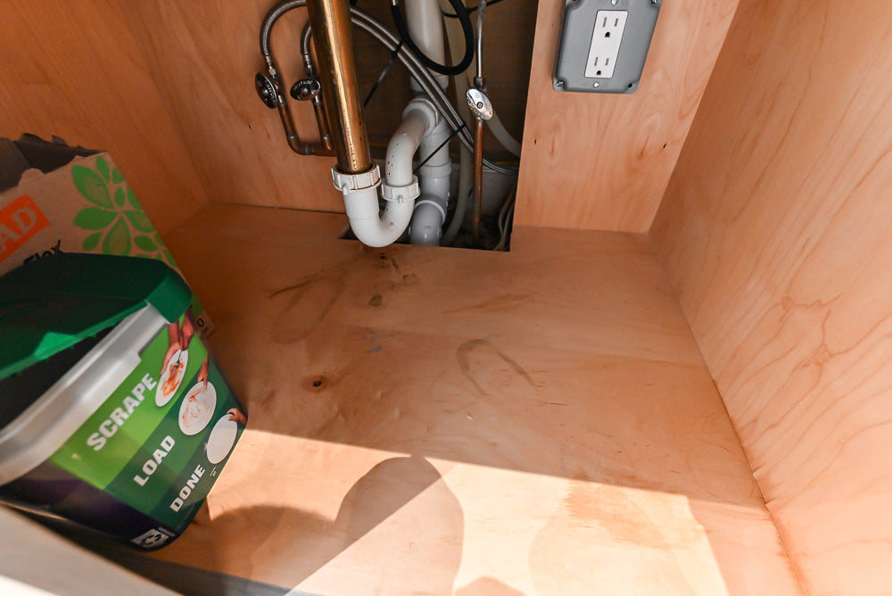 Brubaker Modern White Lacquered Kitchen with Waterfall Island and Stone Countertops