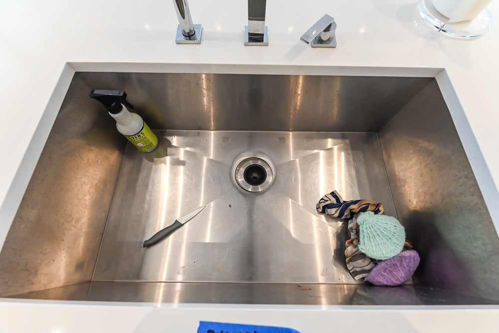 Brubaker Modern White Lacquered Kitchen with Waterfall Island and Stone Countertops