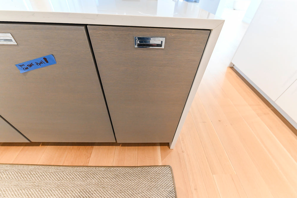 Brubaker Modern White Lacquered Kitchen with Waterfall Island and Stone Countertops