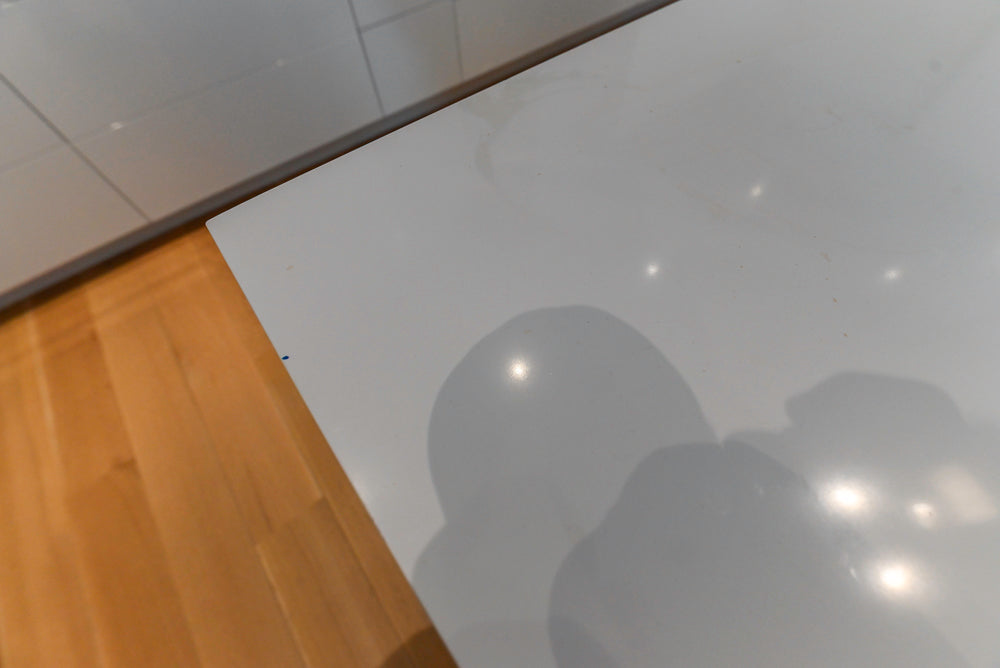 Brubaker Modern White Lacquered Kitchen with Waterfall Island and Stone Countertops