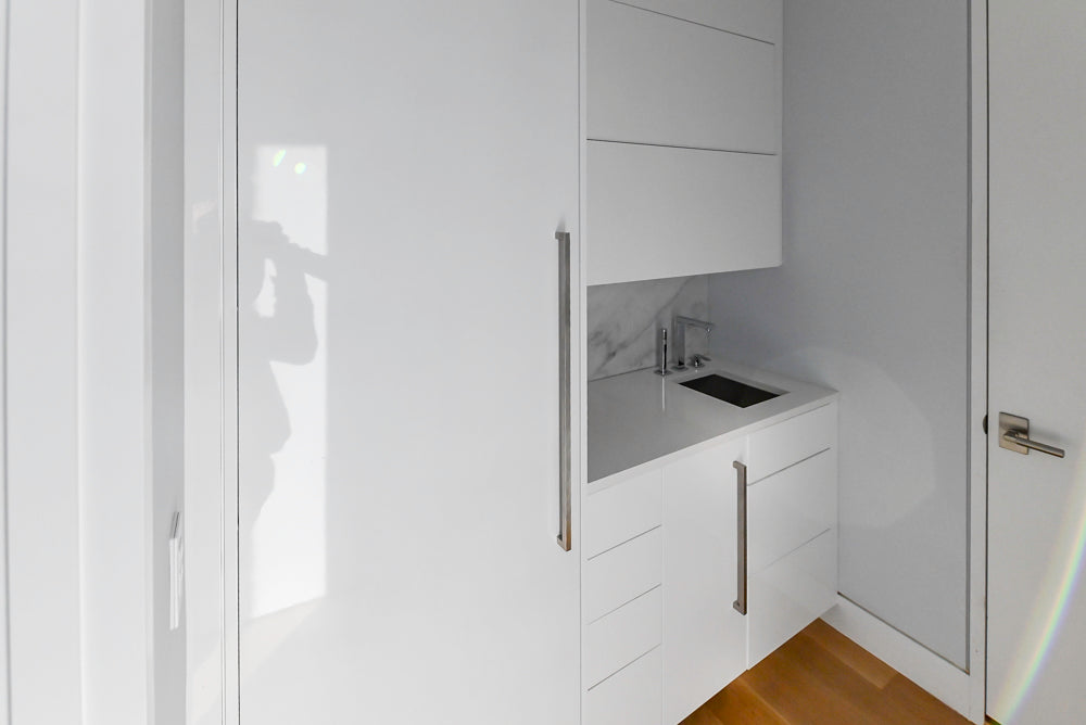 Brubaker Modern White Lacquered Butler's Pantry with Stone Countertops and Ice Maker