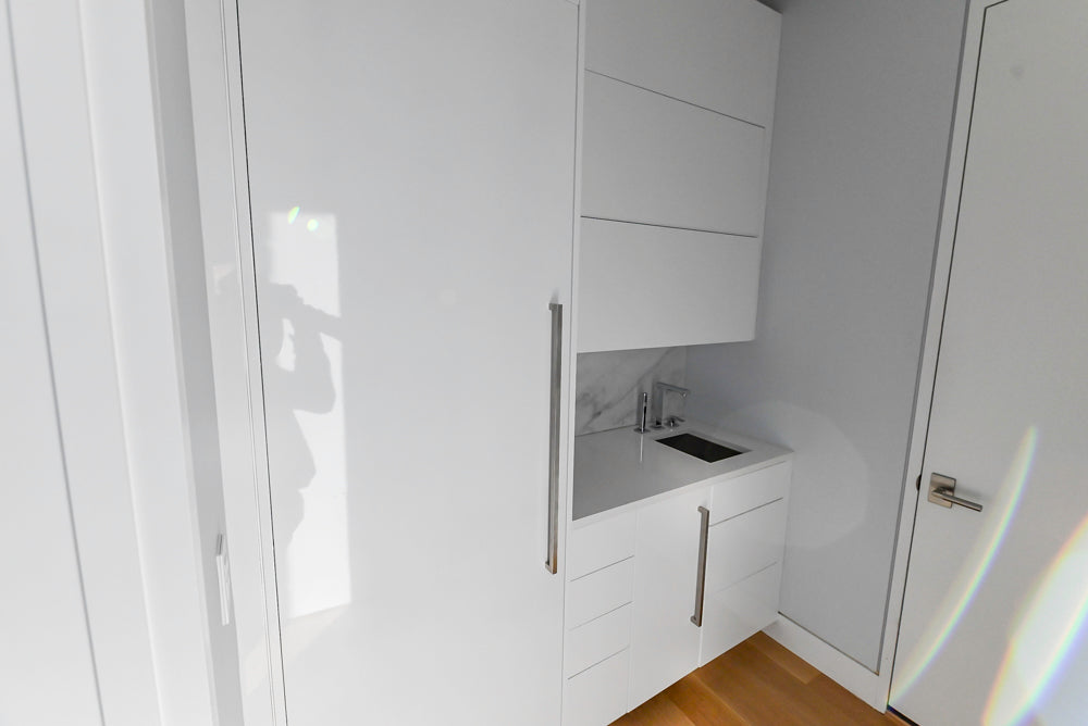 Brubaker Modern White Lacquered Butler's Pantry with Stone Countertops and Ice Maker