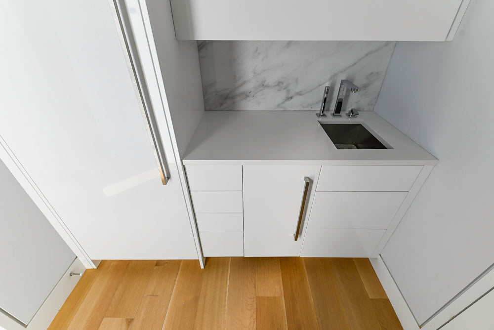 Brubaker Modern White Lacquered Butler's Pantry with Stone Countertops and Ice Maker