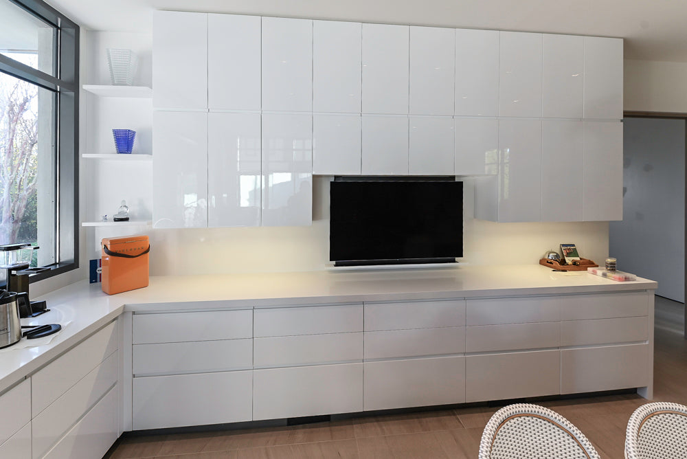 Custom Modern White Gloss Kitchen with Island, Stone Countertops and 60" Wolf Range