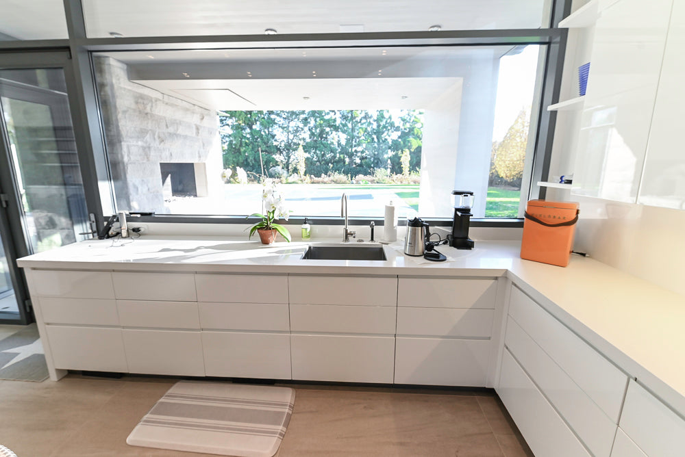 Custom Modern White Gloss Kitchen with Island, Stone Countertops and 60" Wolf Range