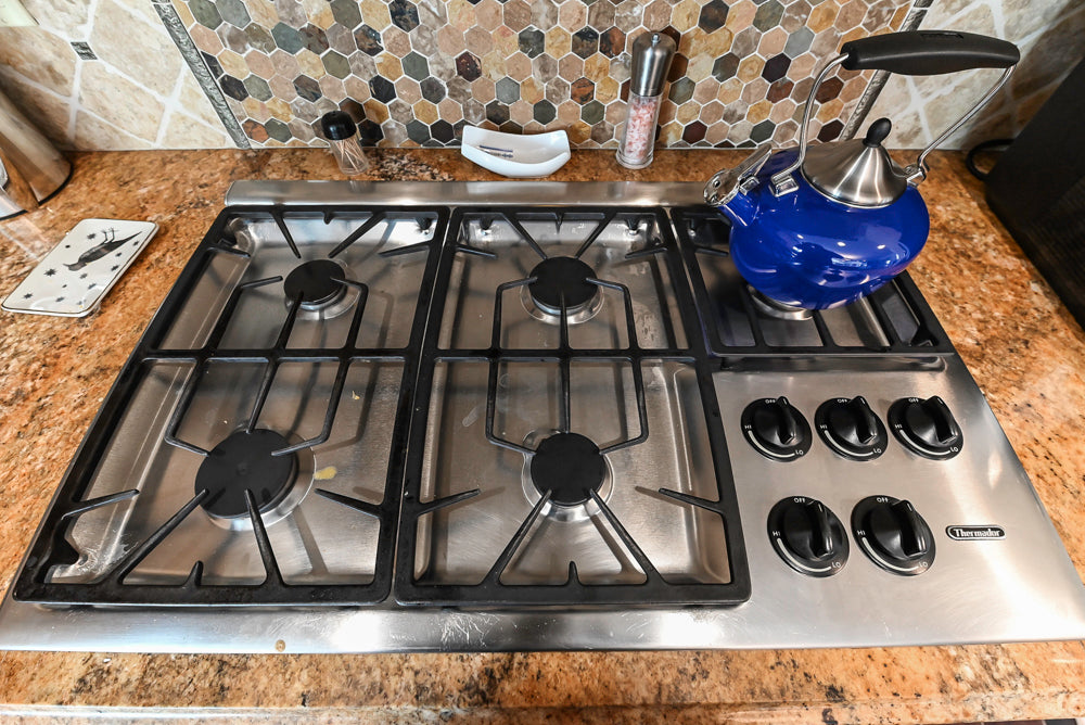 ÒThe HarcourtÓ Traditional Two-Tone Distressed Kitchen with Green Island, Granite Countertops and Appliances