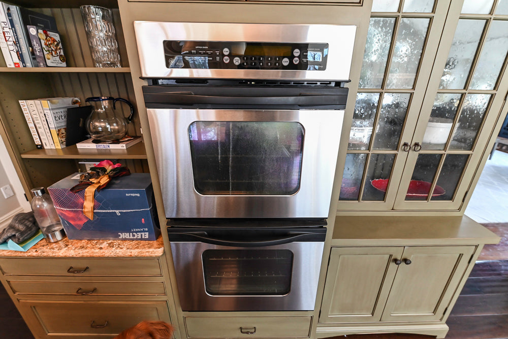 ÒThe HarcourtÓ Traditional Two-Tone Distressed Kitchen with Green Island, Granite Countertops and Appliances