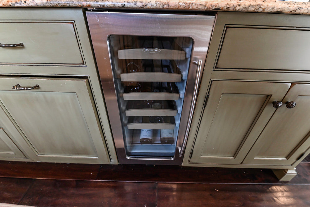 ÒThe HarcourtÓ Traditional Two-Tone Distressed Kitchen with Green Island, Granite Countertops and Appliances
