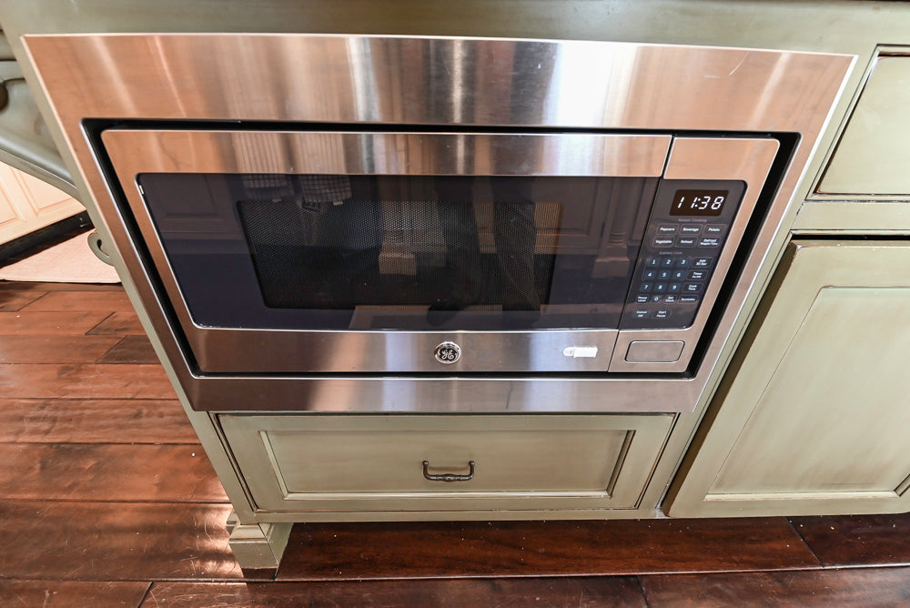 ÒThe HarcourtÓ Traditional Two-Tone Distressed Kitchen with Green Island, Granite Countertops and Appliances