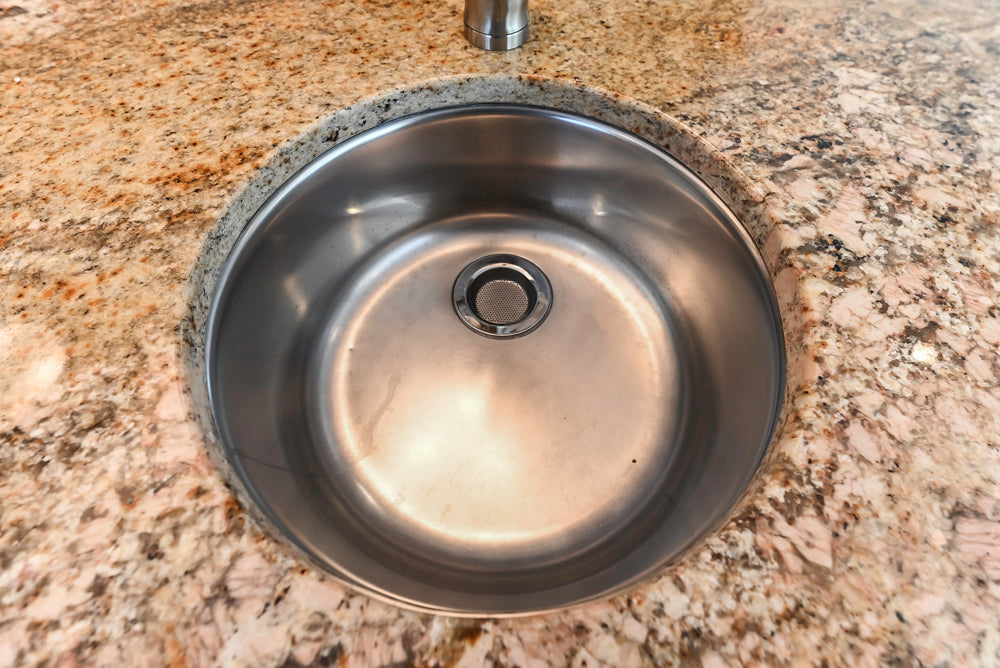 ÒThe HarcourtÓ Traditional Two-Tone Distressed Kitchen with Green Island, Granite Countertops and Appliances