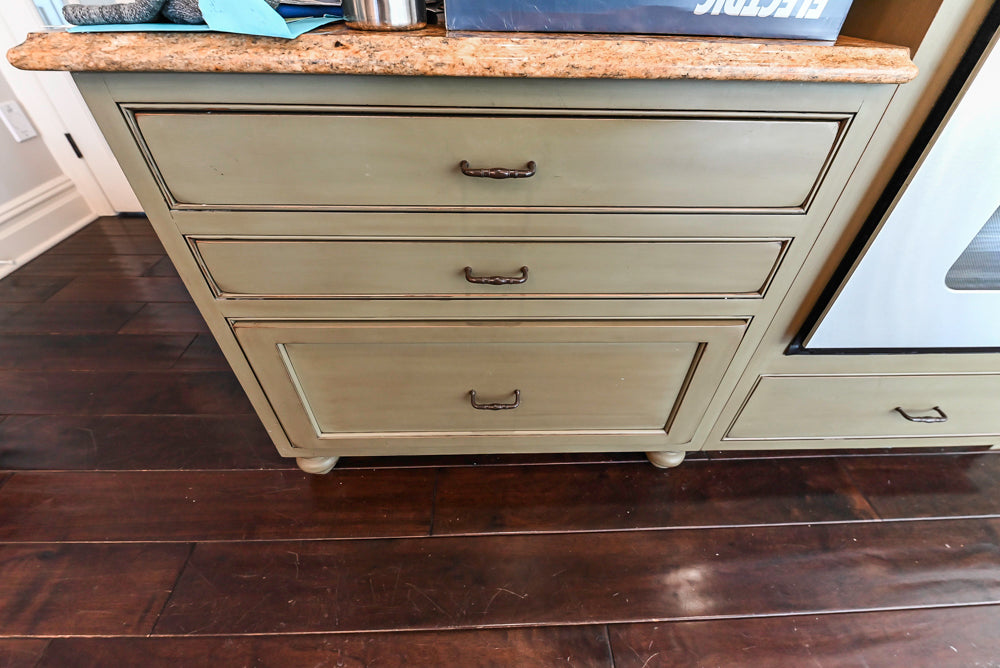 ÒThe HarcourtÓ Traditional Two-Tone Distressed Kitchen with Green Island, Granite Countertops and Appliances
