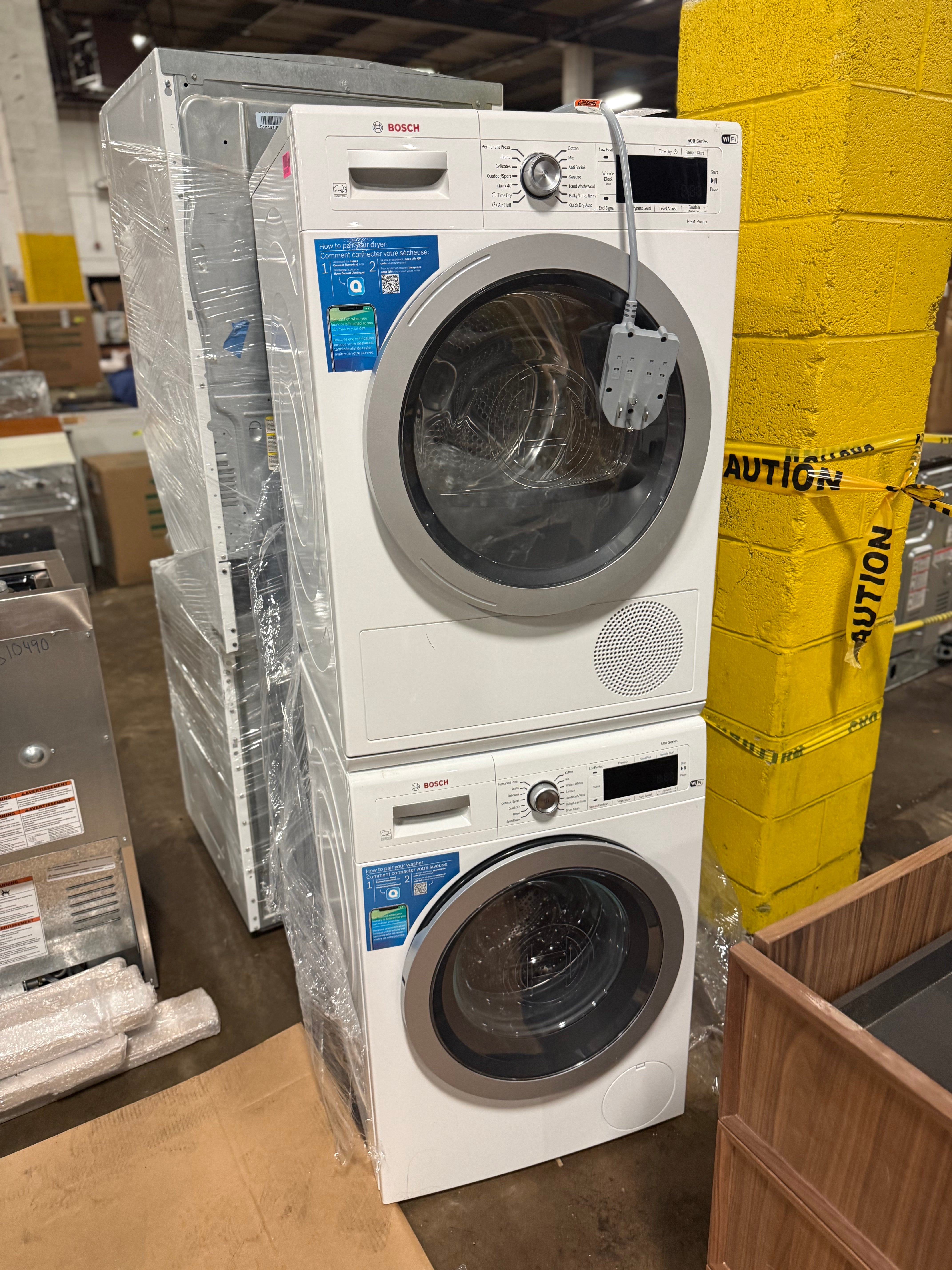 Luxury space saving compact laundry set showing open washer and dryer front load doors
