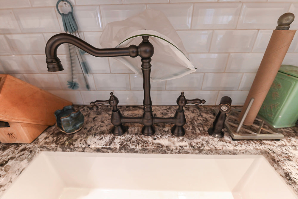 Candelight Traditional Off White Kitchen with Island and Monogram Appliances