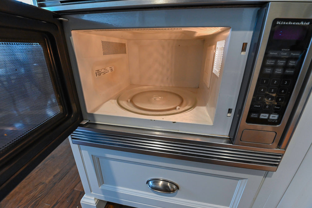 Plain & Fancy Traditional White Kitchen with Island, Marble Countertops & Appliances