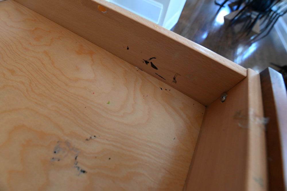 Empty cardboard box with visible wood grain texture