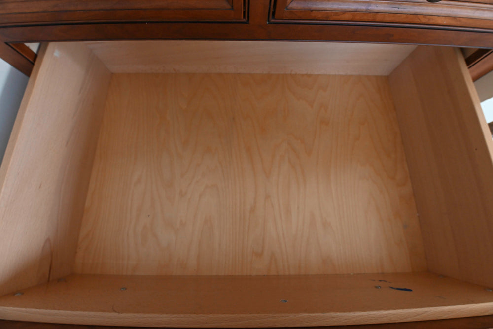 Empty wooden drawer with a blurred background