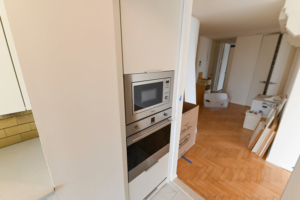 Leicht Modern Off White Kitchenette with Quartz Countertops & Smeg Appliances