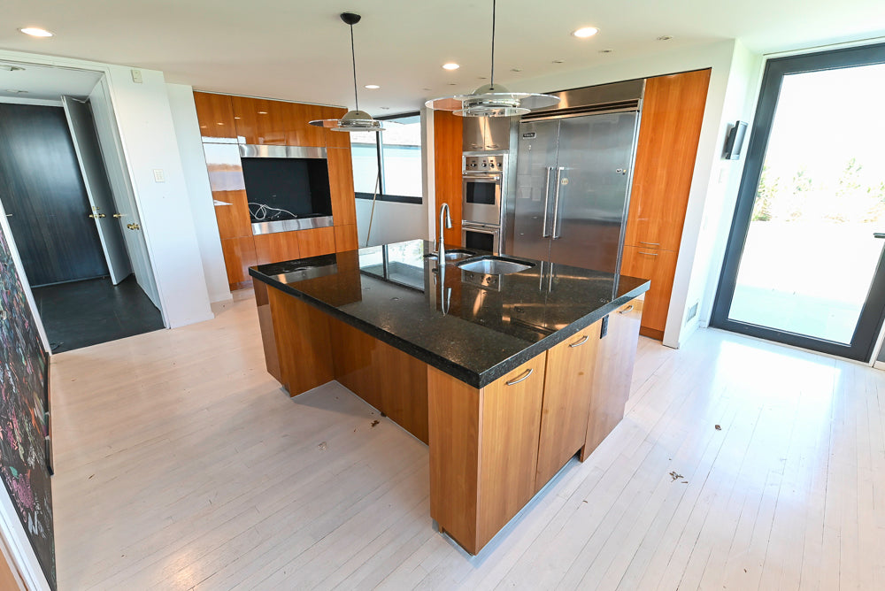 Luxury 48 inch Viking side-by-side refrigerator integrated with Neff designer cabinets