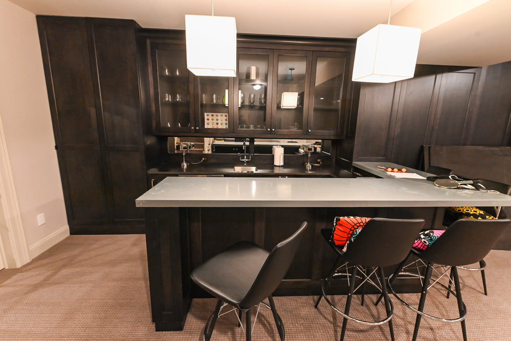 Custom transitional dark brown wood wet bar suite front view with integrated appliances